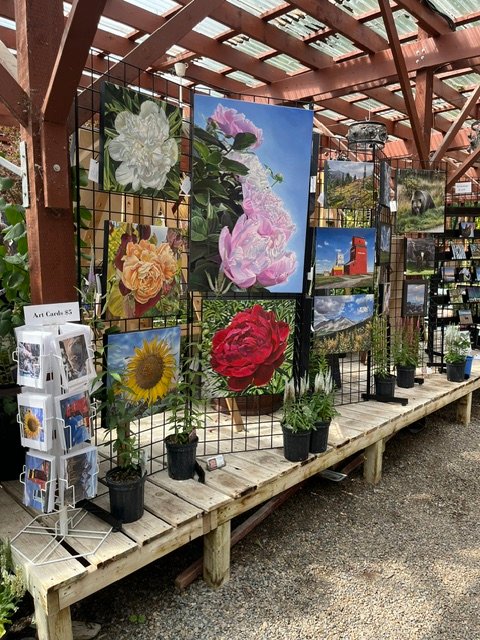 Paintings displayed inside Vale's Greenhouse